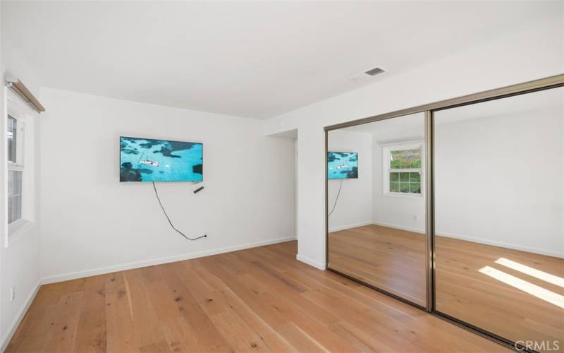 Another view of Guest Bedroom #1 which includes the TV.