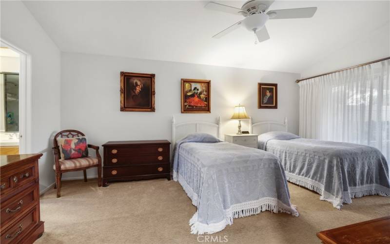 Primary bedroom has a slider to a private patio alcove.