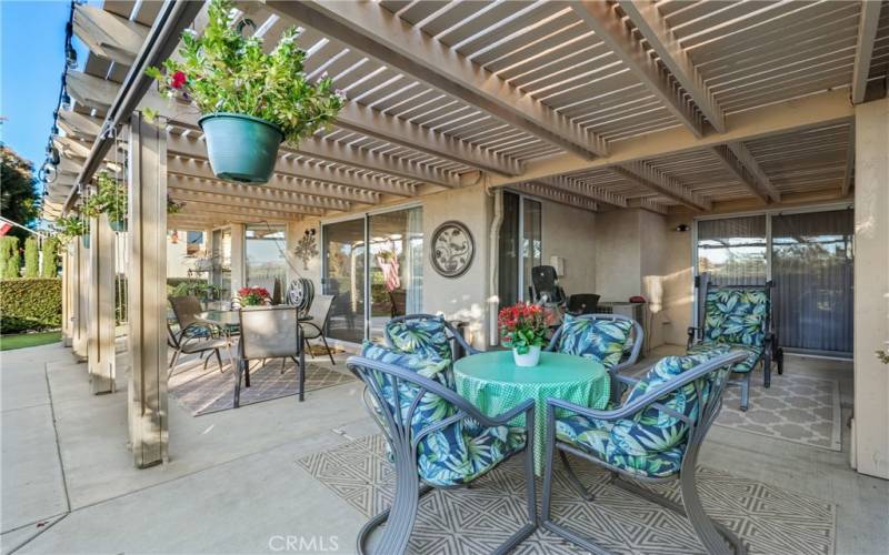 Large back patio is great for entertaining with a patio alcove off the primary bedroom.