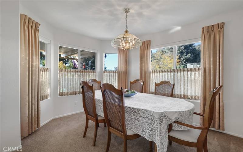 Formal dining room with lovely views to the patio and beyond.