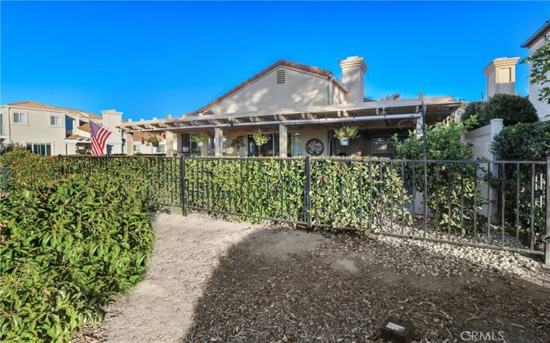 The large greenbelt behind the home and mature hedge makes this yard very private.