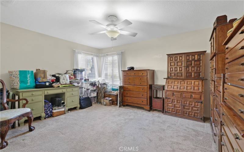 Spacious guest room with a corner window.