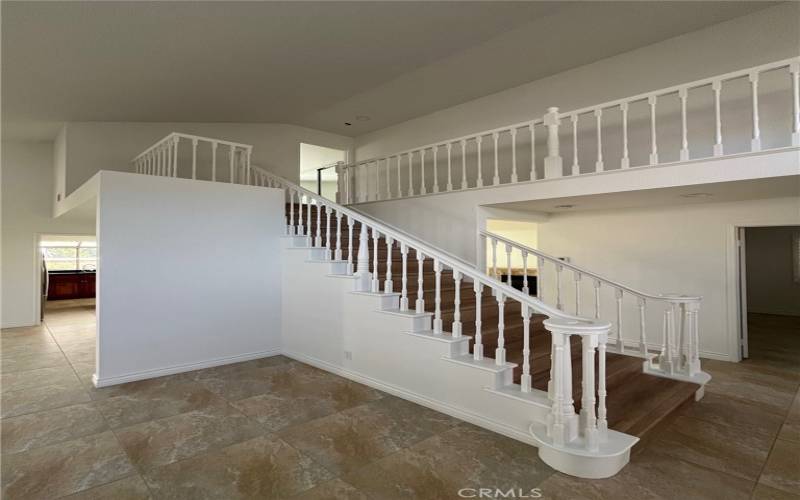 Beautiful Staircase leads to split floor plan upstairs - with primary on one end and secondary bedrooms on opposite end of floor.
