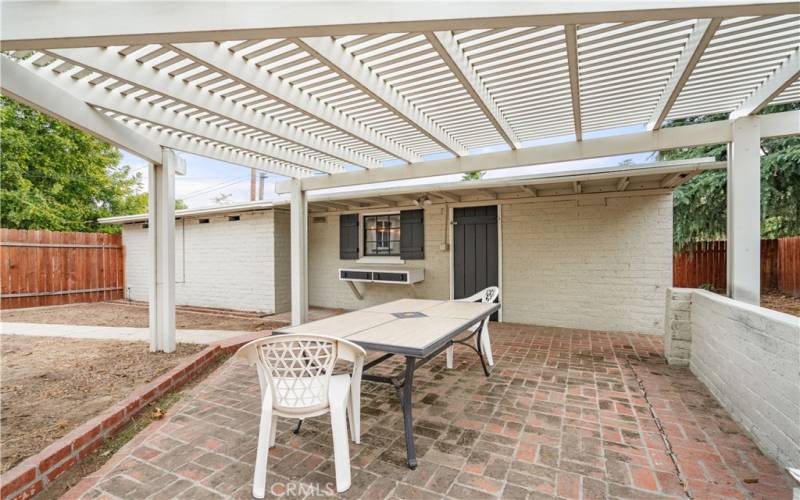 covered patio leading to the game room