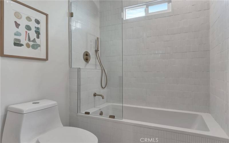 Bathroom 2 with soaking tub and statement vertical tile