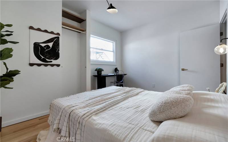 Primary bedroom with custom shelving