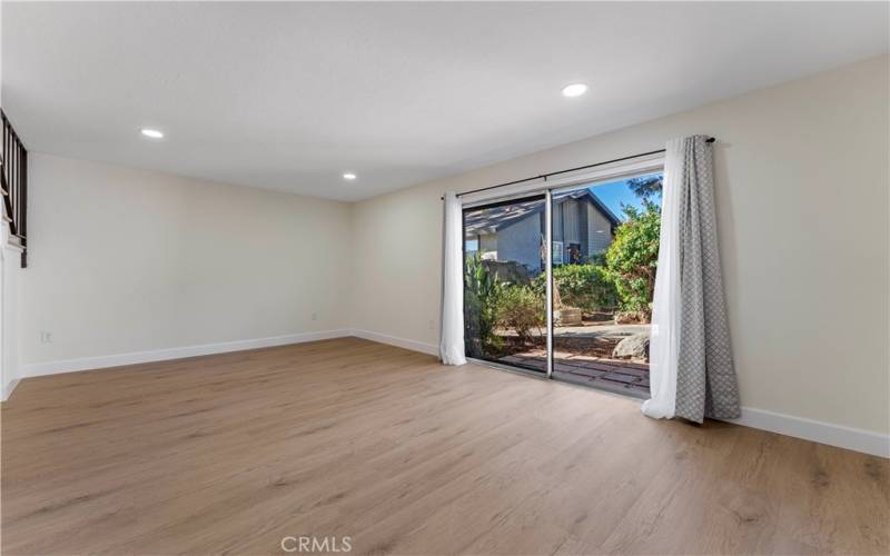 Living room has sliding doors to back yard patio area.