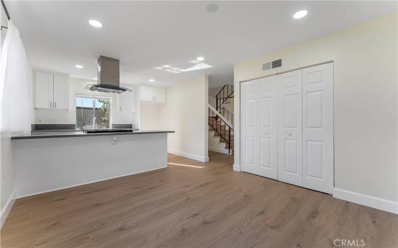 Dining area opens to the  kitchen with new cabinets, countertops and new appliances. In door laundry area.