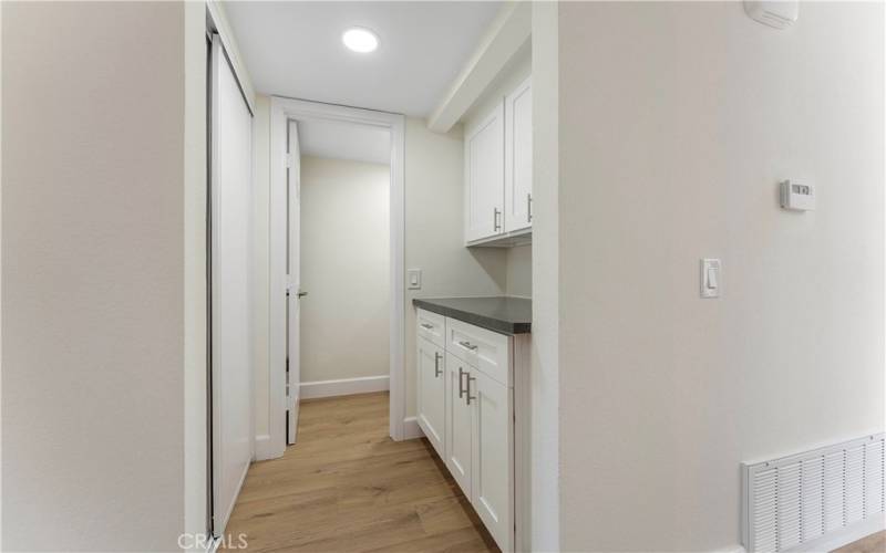 Cabinets in hallway to bathroom.