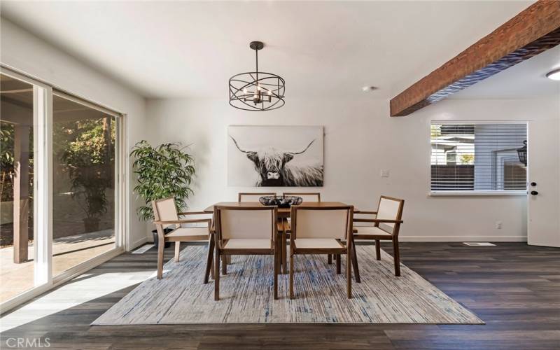 Dining area with large sliding door to patio