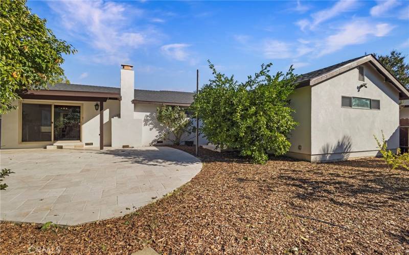 Large Travertine tiled patio of main house