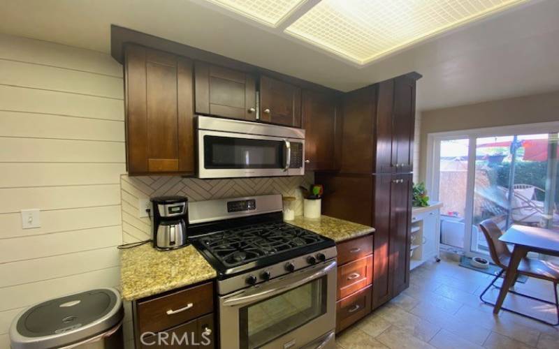 Granite countertops enhance the rich wood cabinetry