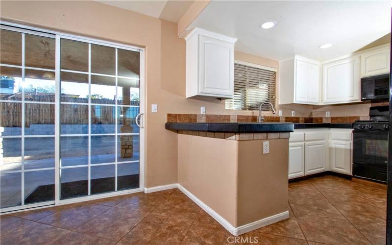 Sliding doors to outdoor kitchen and back patio