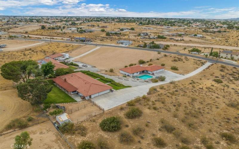 Set back and Elevated from the Street the Long Driveway brings you into your own private family compound.