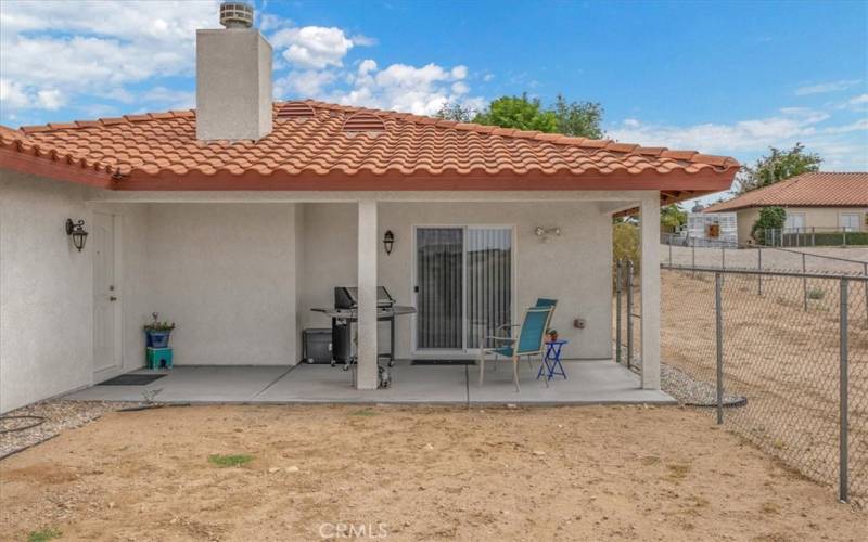 Home #2 - Back Covered Patio with access to the Garage and Slider to the interior Dining Area.