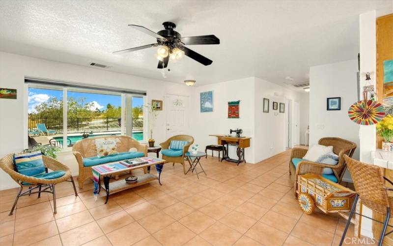 Home #2 - Living Area with large window view to the pool area