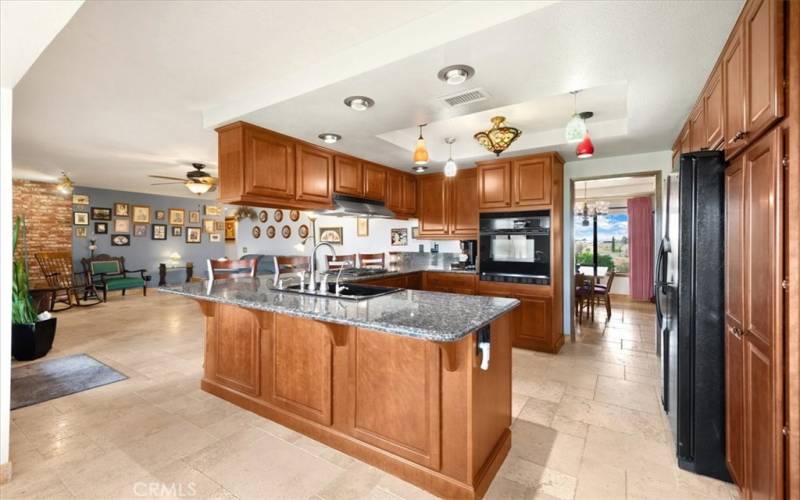 Primary Home - Kitchen with entrance to the Formal Dining Room and Open to the Family Room and Dining Nook