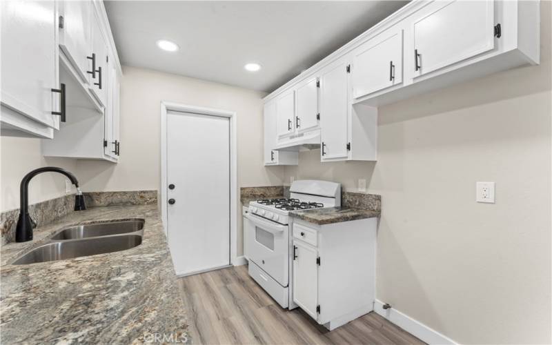 Kitchen View/ door enters into Garage