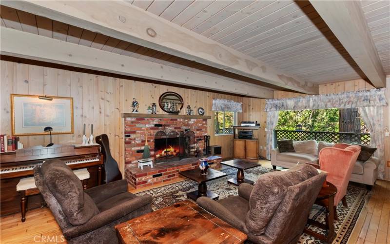 Living room with brick fireplace