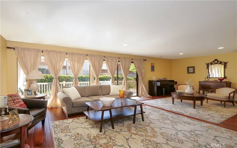 Huge Living Room with Lots of Large Glass Windows Showering the Room with Natural Light