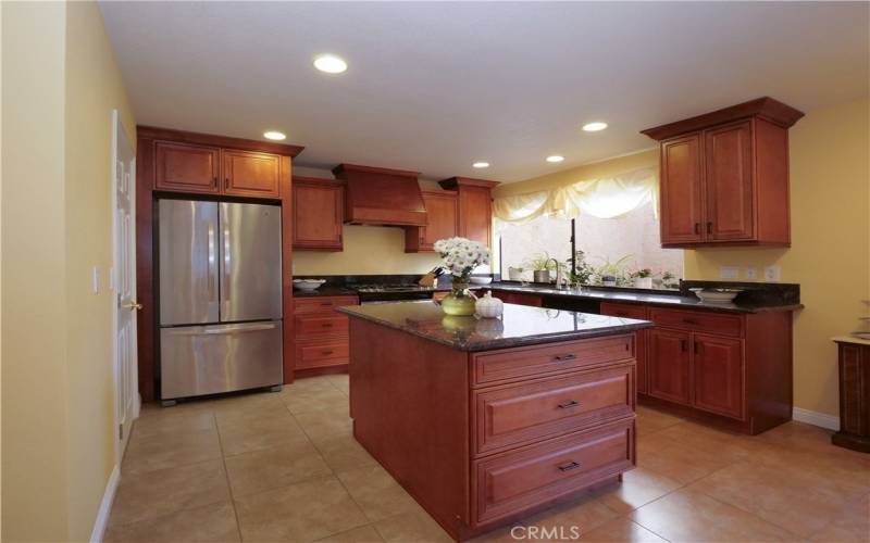 Kitchen with Granite Counters, Self-Closing Drawers, and Tile Floors