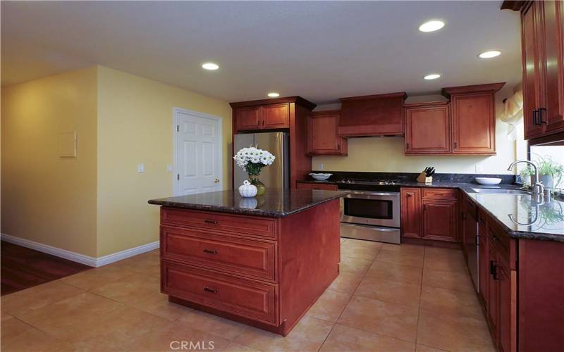 Remodeled Kitchen with Island and Maple Cabinets