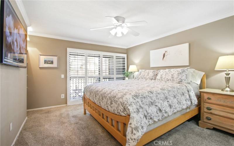 Primary bedroom with w covered balcony!