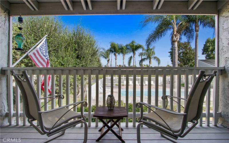 Covered balcony off the primary bedroom with expansive views!