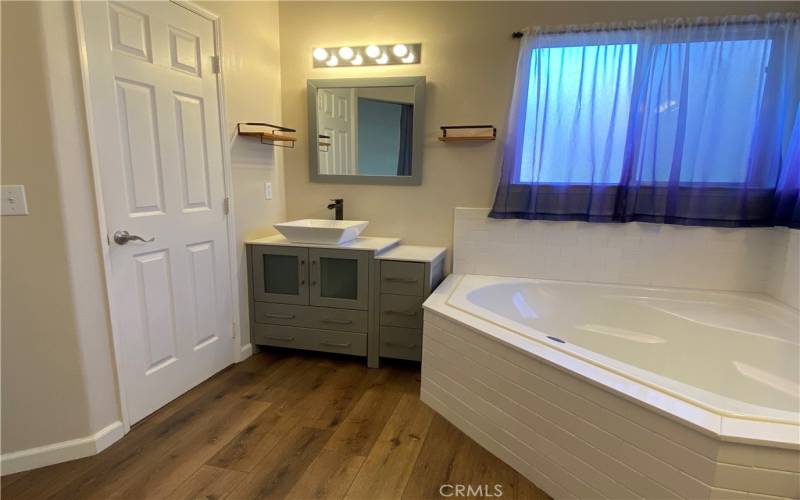 Master Bathroom with soaker tub and his/her vanities.