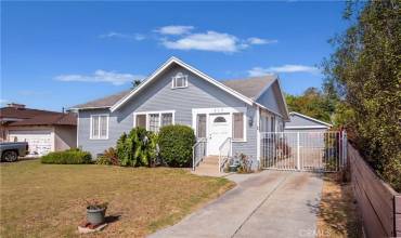 Front view of home with detached garage in back