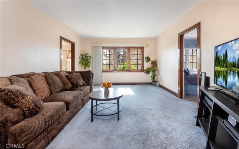 front room with gorgeous big window creating lots of light