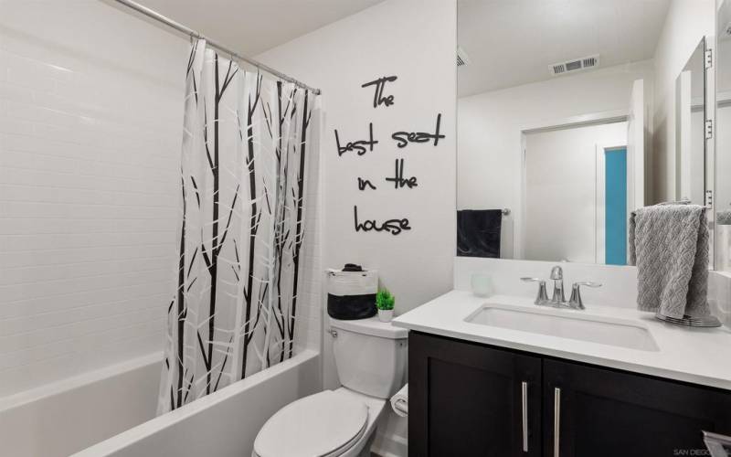 Spacious guest bathroom located on the second floor.