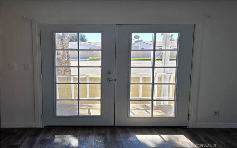 Double doors leading out of the family room.