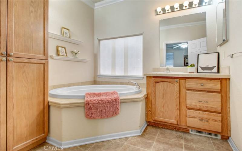 Primary bedroom with soaking tub and shower