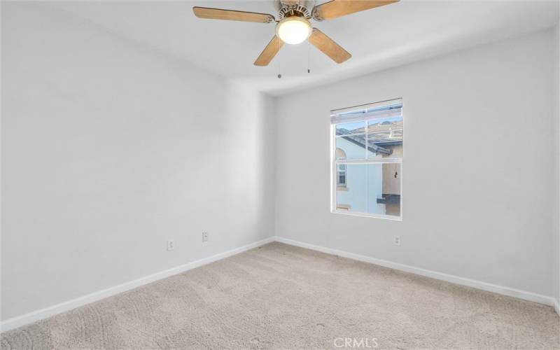 Secondary bedroom #2 with brand-new ceiling fan