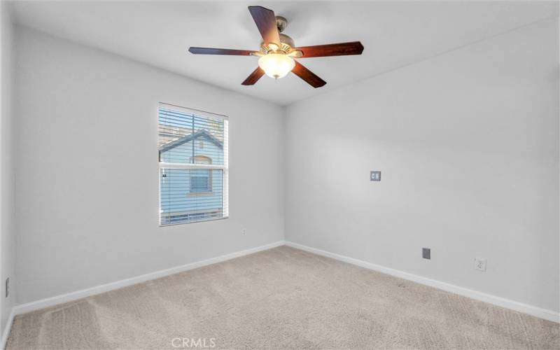 Secondary bedroom #1 with ceiling fan