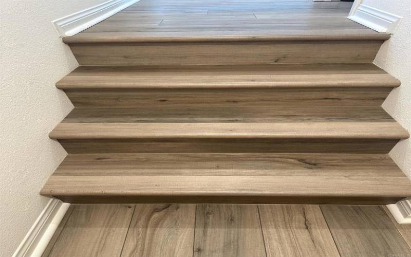 Luxury Vinyl Planks were installed in the entry, stairs and throughout the main level