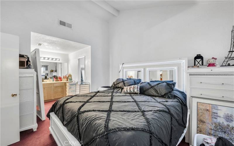 Master bedroom has high ceilings