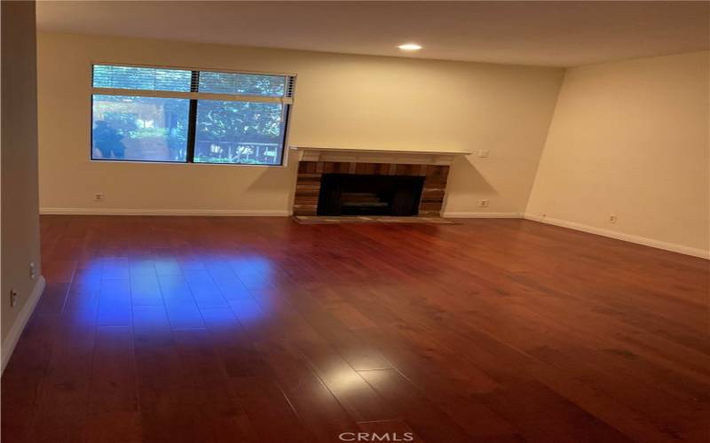 Beautiful floors and Charming Fireplace in Livingroom