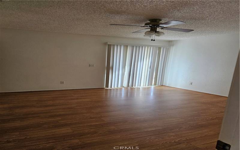 Master bedroom with sliding door access to side and back yard.