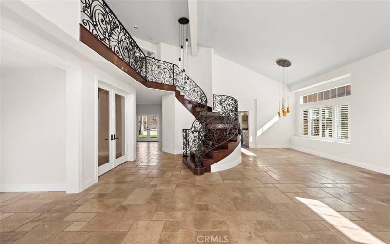 Sweeping iron and wood staircase