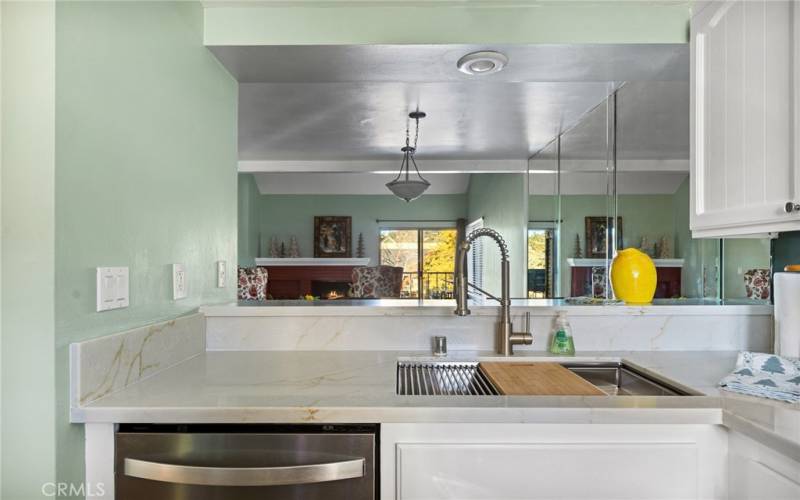 New Quartz countertop. New stainless steal work station sink. Open concept breakfast bar.