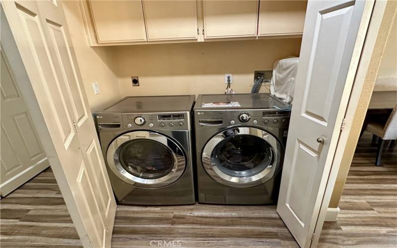 Side by side laundry hookup inside unit