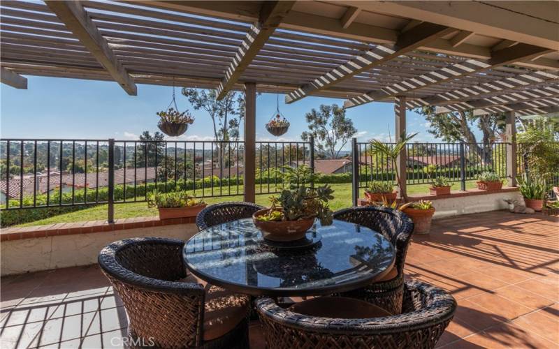 Spacious covered patio overlooking the lawn.