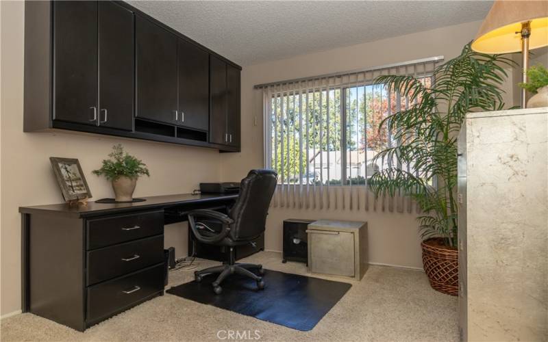 Secondary bedroom is a designated office with built-ins.