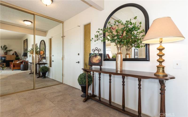 Inside entry with mirrored closet.