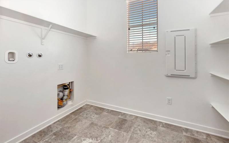 laundry room upstairs with lots of storage