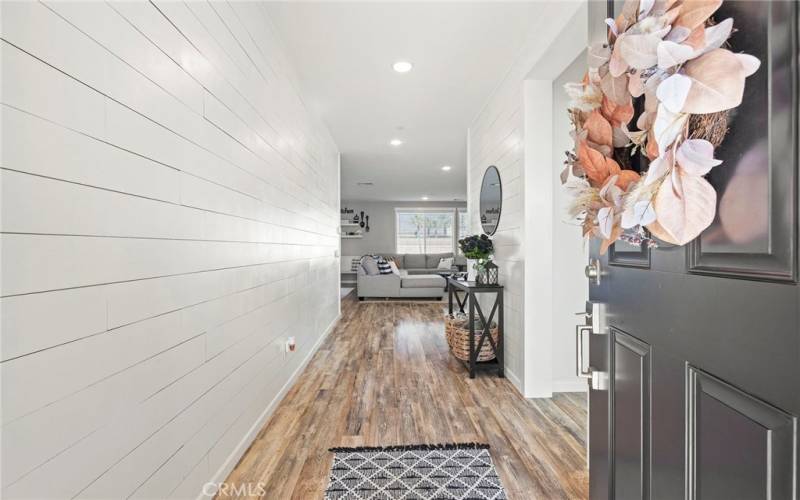 Beautiful entryway with shiplap walls.