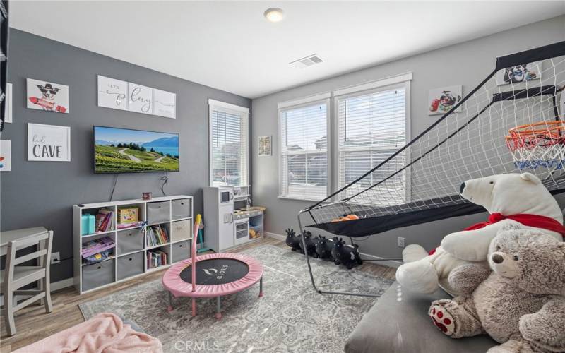 Main level bedroom with a large walk-in closet.