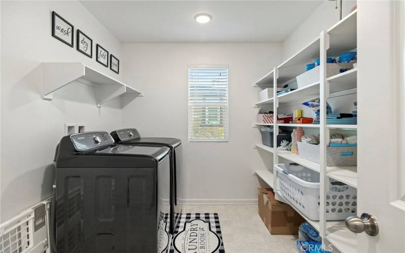 Upper level large laundry room.